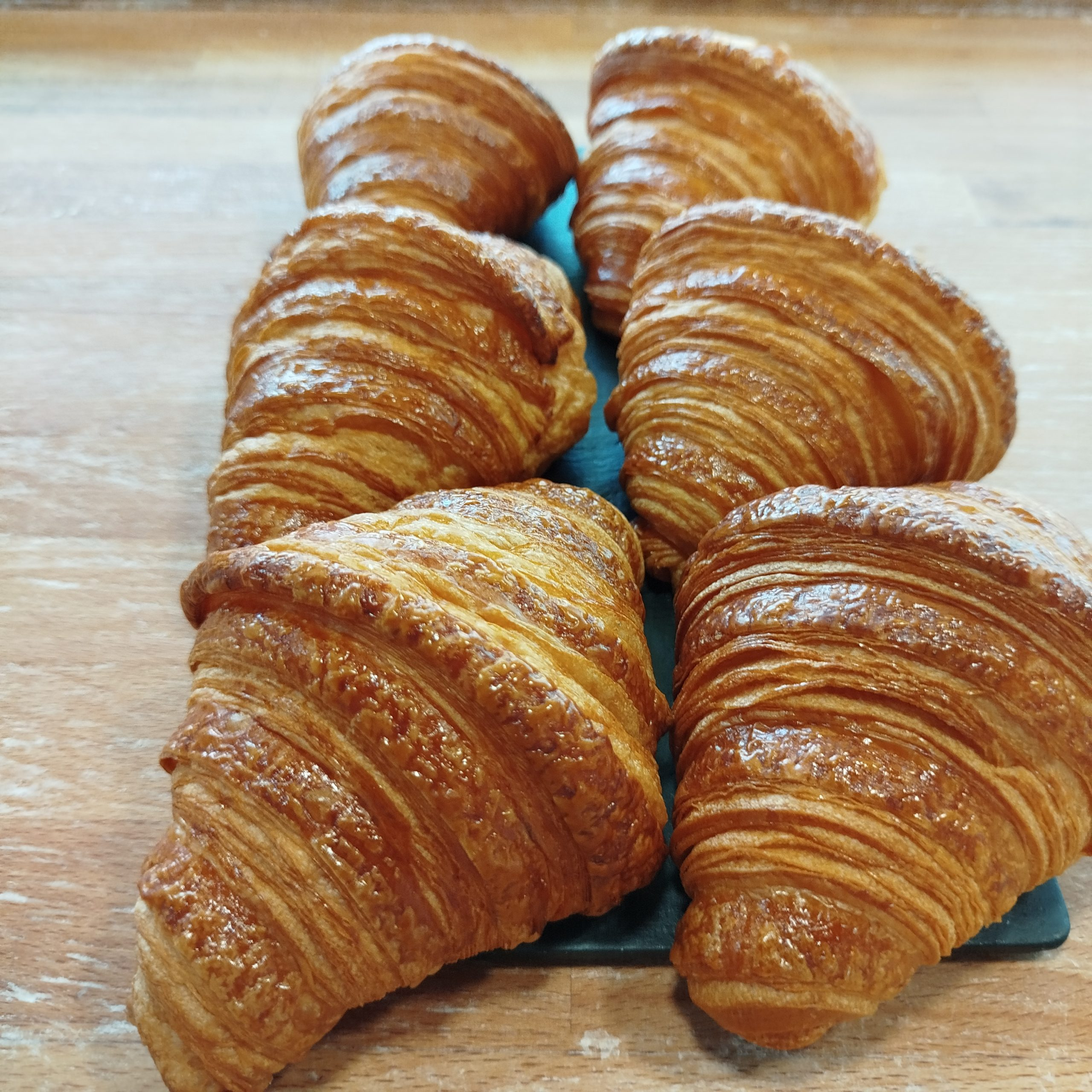 A beautiful spread of various baked goods on a rustic table.